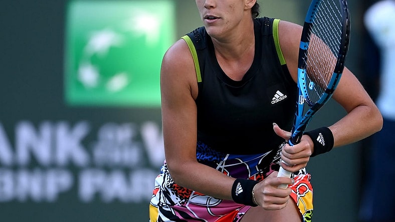 Mar 11, 2022; Indian Wells, CA, USA; Garbine Muguruza (ESP) hits a shot against Alison Riske (USA) in her 2nd round match at the BNP Paribas Open at the Indian Wells Tennis Garden. Mandatory Credit: Jayne Kamin-Oncea-USA TODAY Sports