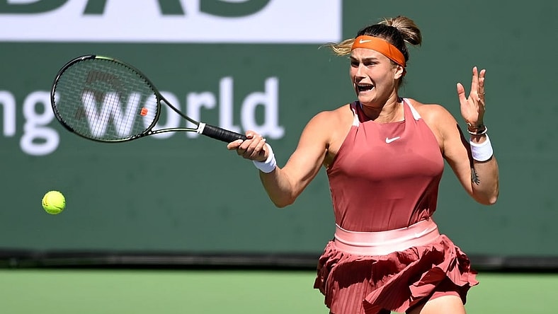 Mar 12, 2022; Indian Wells, CA, USA; Aryana Sabalenka (BEL) hits a shot in her 2nd round match against Jasmine Paolini (ITA) at the BNP Paribas open at the Indian Wells Tennis Garden. Mandatory Credit: Jayne Kamin-Oncea-USA TODAY Sports