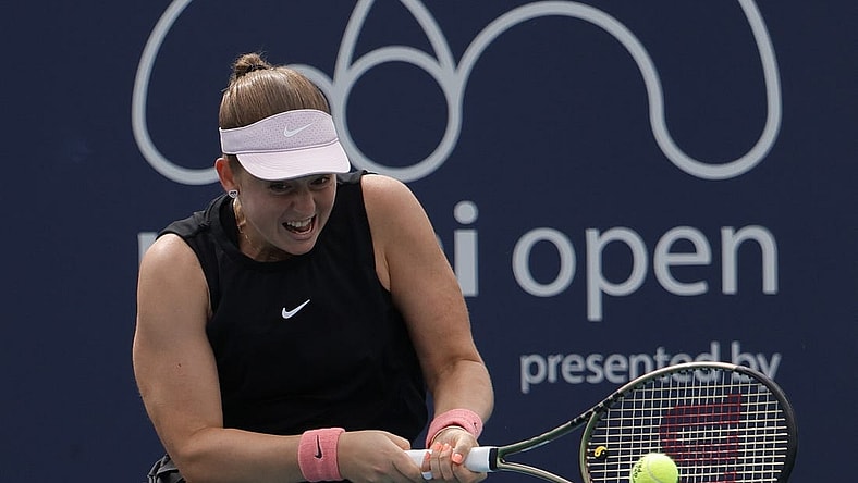 Mar 25, 2022; Miami Gardens, FL, USA; Jelena Ostapenko (LAT) hits a backhand against Shelby Rogers (USA) (not pictured) in a second round women's match in the Miami Open at Hard Rock Stadium. Mandatory Credit: Geoff Burke-USA TODAY Sports