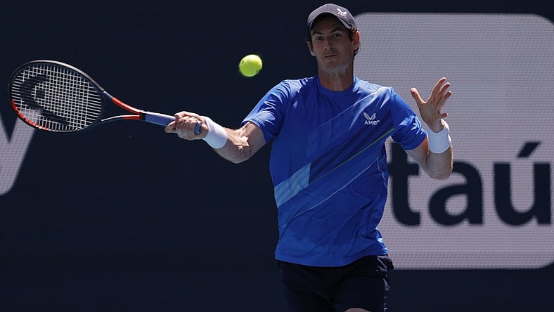 Mar 26, 2022; Miami Gardens, FL, USA; Andy Murray (GBR) hits a forehand against Daniil Medvedev (not pictured) in a second round men's singles match in the Miami Open at Hard Rock Stadium. Mandatory Credit: Geoff Burke-USA TODAY Sports