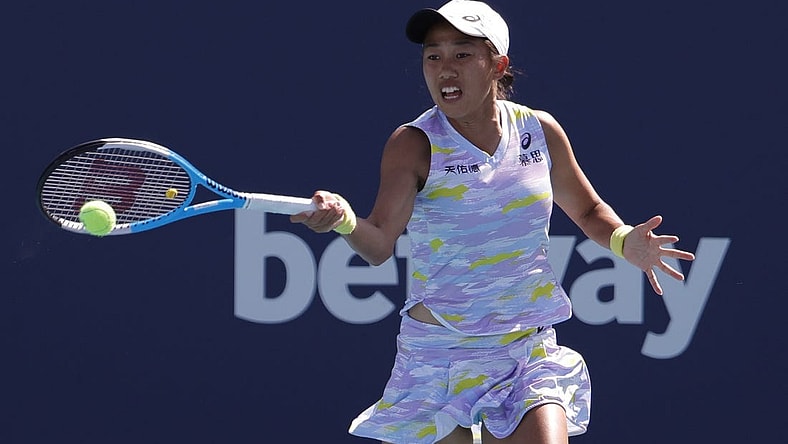 Mar 27, 2022; Miami Gardens, FL, USA; Shuai Zhang hits a forehand against Coco Gauff (USA) in a third round women's singles match in the Miami Open at Hard Rock Stadium. Mandatory Credit: Geoff Burke-USA TODAY Sports