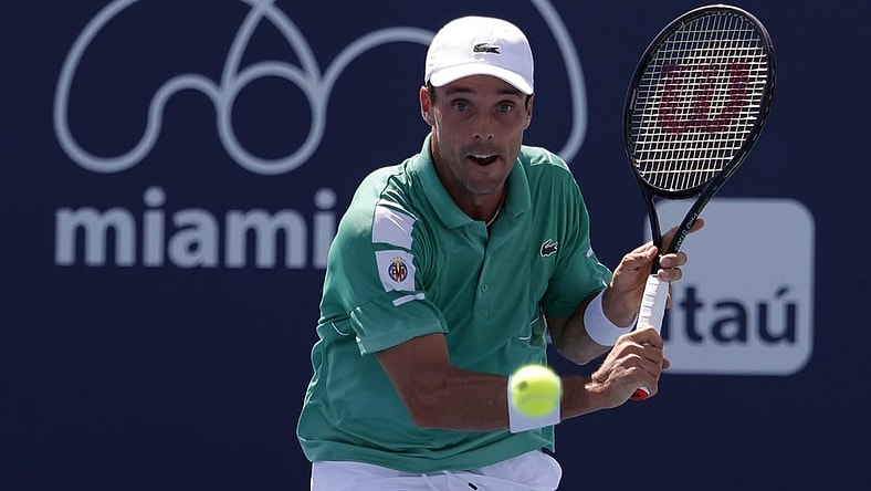 Mar 28, 2022; Miami Gardens, FL, USA; Roberto Bautista Agut (ESP) hits a backhand against Jenson Brooksby (USA)(not pictured) in a third round men's singles match in the Miami Open at Hard Rock Stadium. Mandatory Credit: Geoff Burke-USA TODAY Sports