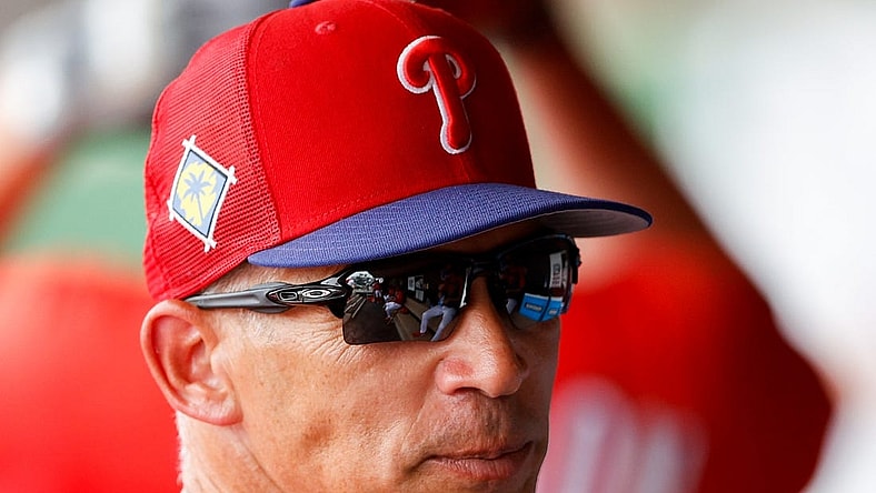 Mar 31, 2022; Clearwater, Florida, USA; Philadelphia Phillies manager Joe Girardi  (25) looks on from the dugout in the sixth inning against the New York Yankees during spring training at BayCare Ballpark. Mandatory Credit: Nathan Ray Seebeck-USA TODAY Sports