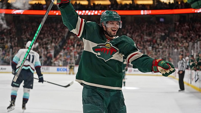 Apr 22, 2022; Saint Paul, Minnesota, USA; Minnesota Wild left wing Kevin Fiala (22) celebrates his fifth assist of the night against the Seattle Kraken on a goal scored by Minnesota Wild forward Nicolas Deslauriers (not pictured) during the second period at Xcel Energy Center. Mandatory Credit: Nick Wosika-USA TODAY Sports