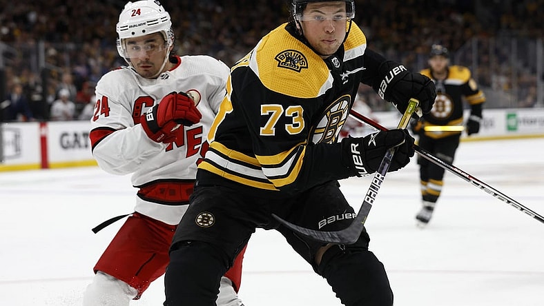 May 6, 2022; Boston, Massachusetts, USA; Boston Bruins defenseman Charlie McAvoy (73) gets position on Carolina Hurricanes center Seth Jarvis (24) during the third period in game three of the first round of the 2022 Stanley Cup Playoffs at TD Garden. Mandatory Credit: Winslow Townson-USA TODAY Sports