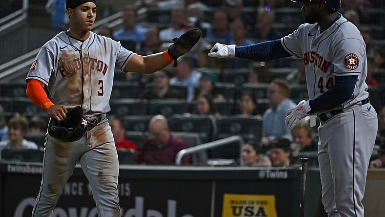 May 10, 2022; Minneapolis, Minnesota, USA;  Houston Astros shortstop Jeremy Pena (3) is congratulated for scoring a run by designated hitter Yordan Alvarez (44) against the Minnesota Twins during the sixth inning at Target Field. Mandatory Credit: Nick Wosika-USA TODAY Sports