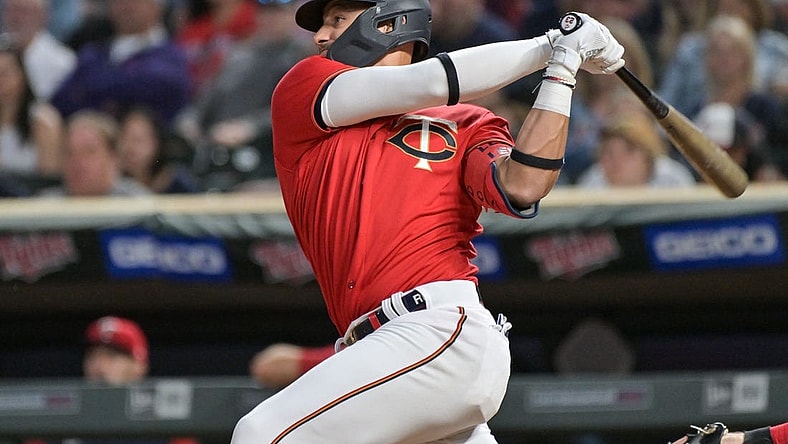 May 13, 2022; Minneapolis, Minnesota, USA; Minnesota Twins shortstop Royce Lewis (23) doubles to deep left center off Cleveland Guardians starting pitcher Aaron Civale (not pictured) during the fifth inning at Target Field. Lewis would later hit a grand slam home run in the same inning. Mandatory Credit: Jeffrey Becker-USA TODAY Sports