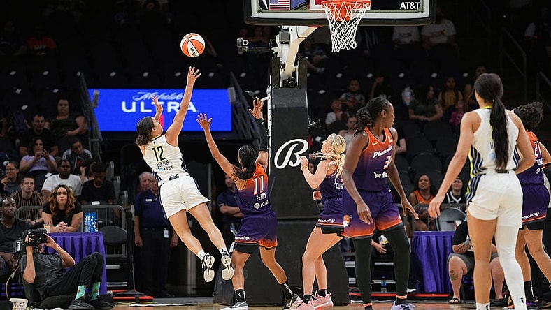 Dallas Wings guard Veronica Burton (12), left, shoots the ball while off balance during the second half against the Dallas Wings at the Footprint Center on Thursday, May 19, 2022, in Phoenix. The Mercury lost 84 to 94.

Uscp 7l2kp07z4a912iwb01rk2 Original
