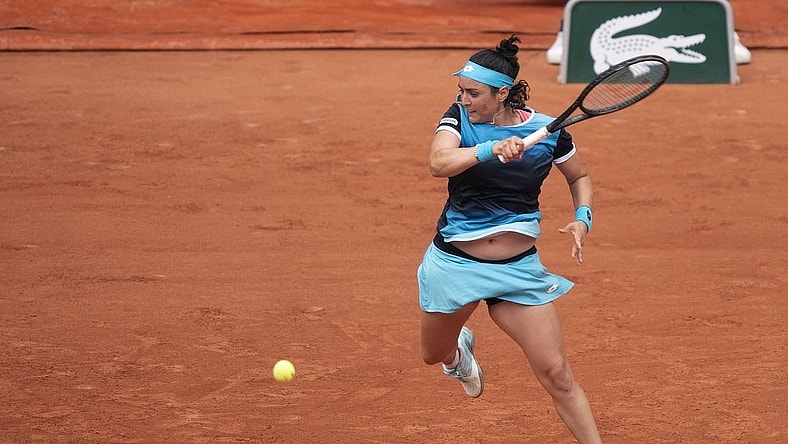 May 22, 2022; Paris, France;  Ons Jabeur (TUN) returns the ball during her match against Magda Linette (POL) on day one of the French Open at Stade Roland-Garros. Mandatory Credit: Susan Mullane-USA TODAY Sports
