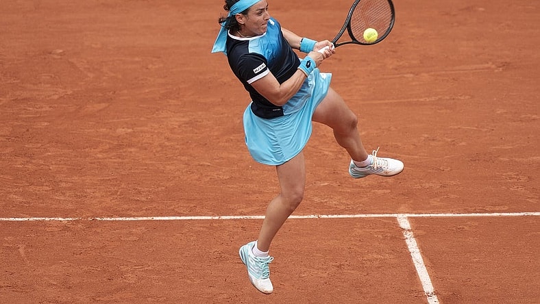 May 22, 2022; Paris, France;  Ons Jabeur (TUN) returns the ball during her match against Magda Linette (POL) on day one of the French Open at Stade Roland-Garros. Mandatory Credit: Susan Mullane-USA TODAY Sports