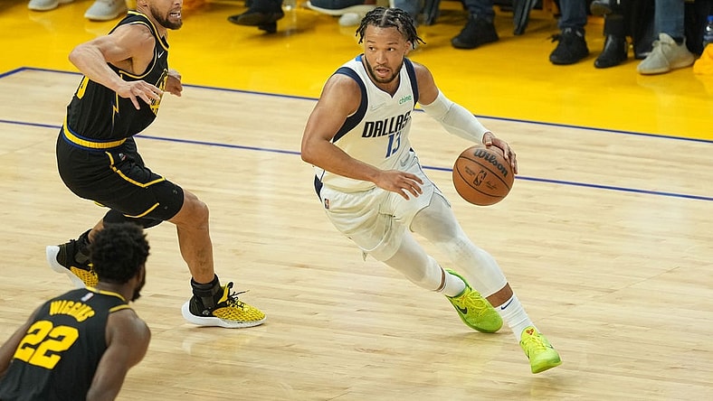 May 18, 2022; San Francisco, California, USA; Dallas Mavericks guard Jalen Brunson (13) dribbles against Golden State Warriors guard Stephen Curry (30) during the second quarter of game one of the 2022 western conference finals at Chase Center. Mandatory Credit: Darren Yamashita-USA TODAY Sports