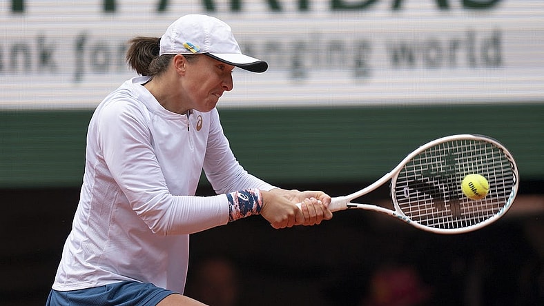 May 28, 2022; Paris, France; Iga Swiatek (POL) returns a shot during her match against Danka Kovinic (MNE) on day seven of the French Open at Stade Roland-Garros. Mandatory Credit: Susan Mullane-USA TODAY Sports
