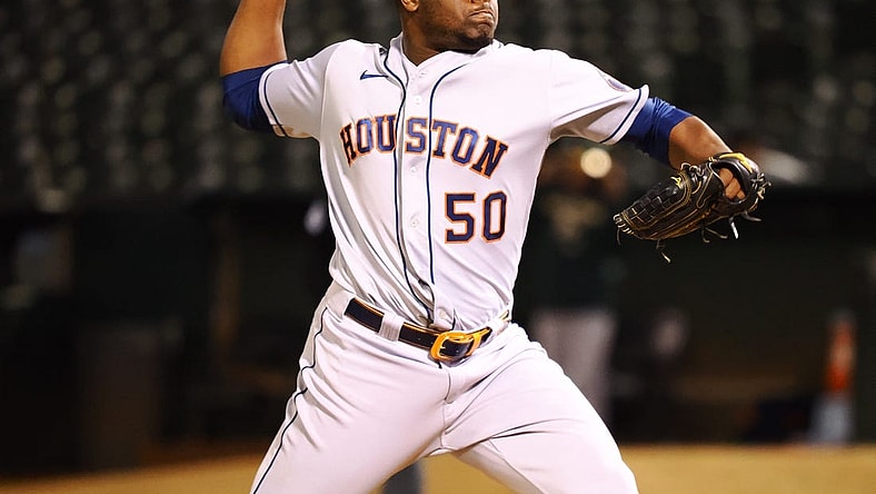 May 31, 2022; Oakland, California, USA; Houston Astros relief pitcher Hector Neris (50) pitches the ball against the Oakland Athletics during the eighth inning at RingCentral Coliseum. Mandatory Credit: Kelley L Cox-USA TODAY Sports