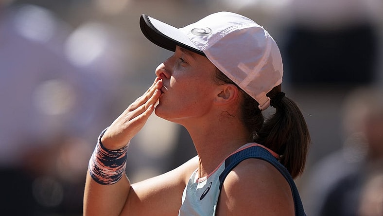 June 1, 2022; Paris, France; Iga Swiatek (POL) celebrates winning her match against Jessica Pegula (USA) on day 11 of the French Open at Stade Roland-Garros. Mandatory Credit: Susan Mullane-USA TODAY Sports