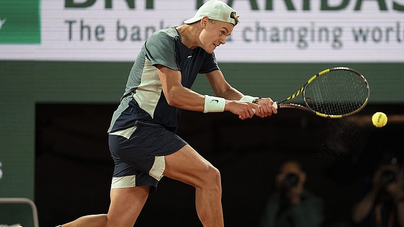 June 1, 2022; Paris, France; Holger Rune (DEN) returns a shot during his match against Casper Ruud (NOR) on day 11 of the French Open at Stade Roland-Garros. Mandatory Credit: Susan Mullane-USA TODAY Sports