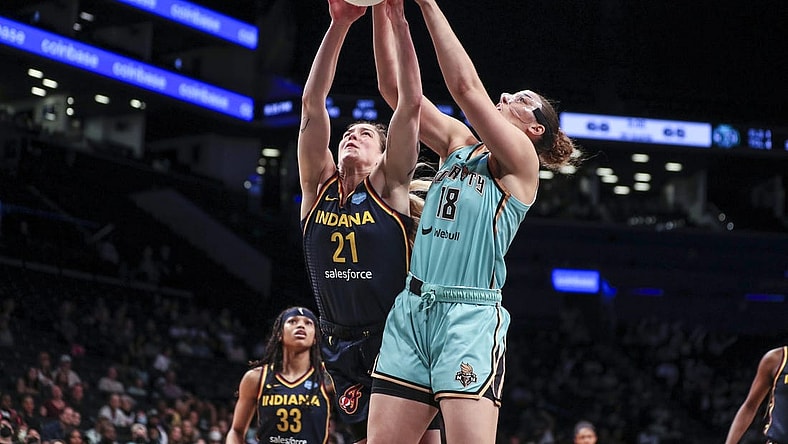 Jun 1, 2022; Brooklyn, New York, USA; Indiana Fever forward Emily Engstler (21) and New York Liberty forward Lorela Cubaj (18) fight for a rebound in the fourth quarter at Barclays Center. Mandatory Credit: Wendell Cruz-USA TODAY Sports