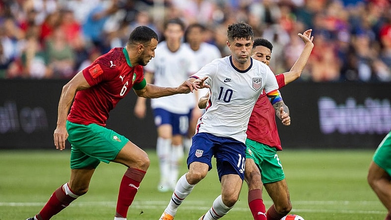 Jun 1, 2022; Cincinnati, Ohio, USA; United States forward Christian Pulisic (10) dribbles the ball while Morocco midfielder Imran Louza (7) defends during an International friendly soccer match at TQL Stadium. Mandatory Credit: Trevor Ruszkowski-USA TODAY Sports