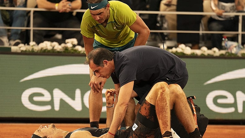 June 3, 2022; Paris, France; Alexander Zverev (GER) falls during his semifinal match against Rafael Nadal (ESP) and has to retire from the match on day 13 of the French Open at Stade Roland-Garros. He was taken from the court in a wheelchair and came back out with crutches to officially retire from the match. Mandatory Credit: Susan Mullane-USA TODAY Sports