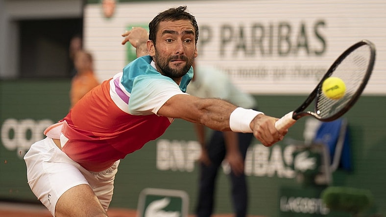 June 3, 2022; Paris, France; Marin Cilic (CRO) returns a shot during his  semifinal match against Casper Ruud (NOR) on day 13 of the French Open at Stade Roland-Garros. Mandatory Credit: Susan Mullane-USA TODAY Sports