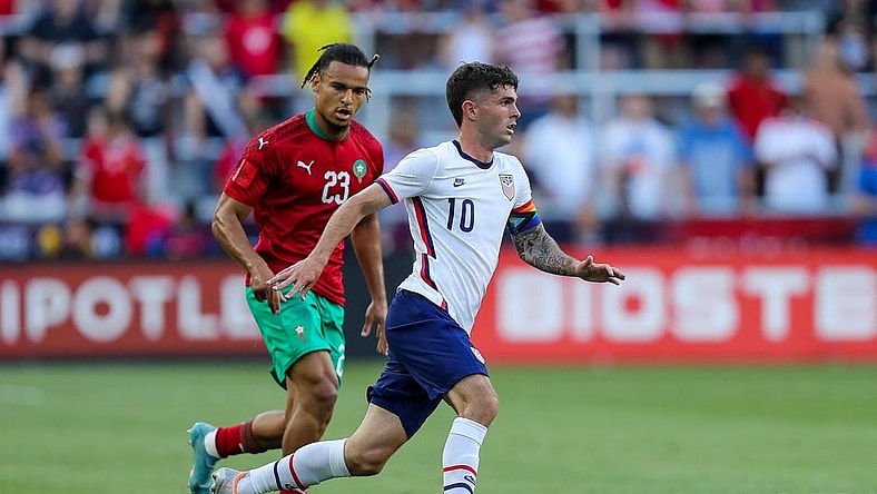 Jun 1, 2022; Cincinnati, Ohio, USA; United States forward Christian Pulisic (10) dribbles against Morocco forward Samy Mmaee (23) in the first half during an International friendly soccer match at TQL Stadium. Mandatory Credit: Katie Stratman-USA TODAY Sports