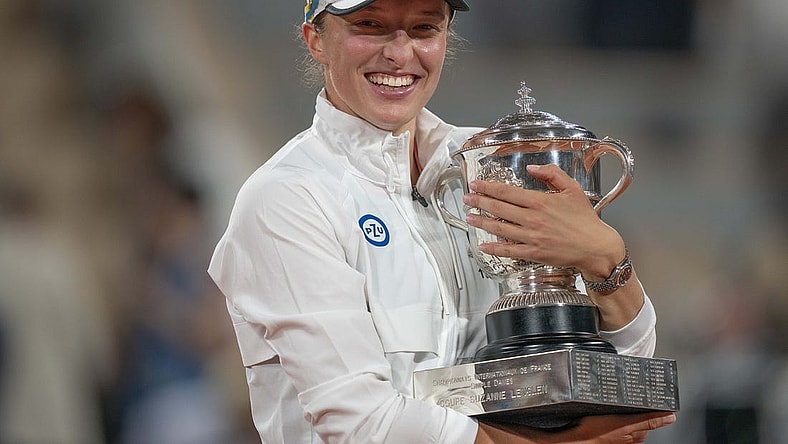 June 4, 2022; Paris, France; Iga Swiatek (POL) poses with the trophy after winning the women's singles final against Coco Gauff (USA) on day 14 of the French Open at Stade Roland-Garros. Mandatory Credit: Susan Mullane-USA TODAY Sports