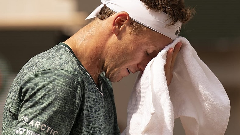June 5, 2022; Paris, France; Casper Ruud (NOR) takes a towel break during the men s singles final against Rafael Nadal (ESP) on day 15 of the French Open at Stade Roland-Garros. Mandatory Credit: Susan Mullane-USA TODAY Sports