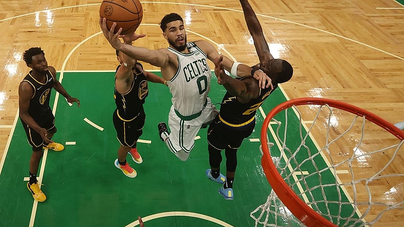 Jun 8, 2022; Boston, Massachusetts, USA; Boston Celtics forward Jayson Tatum (0) attempts a basket in front of Golden State Warriors forward Draymond Green (23) in the second half during game three of the 2022 NBA Finals at TD Garden. Mandatory Credit: Kyle Terada-USA TODAY Sports