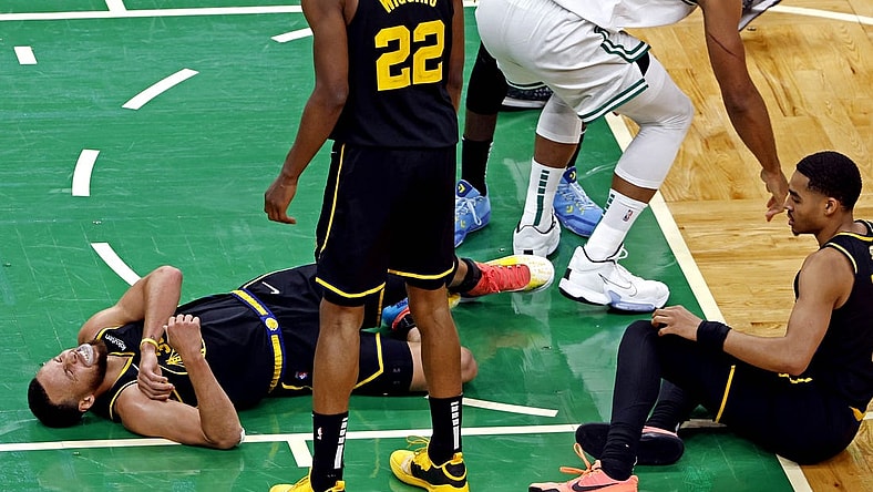 Jun 8, 2022; Boston, Massachusetts, USA; Golden State Warriors guard Stephen Curry (30) reacts to an apparent injury during the fourth quarter against the Boston Celtics in game three of the 2022 NBA Finals at TD Garden. Mandatory Credit: Winslow Townson-USA TODAY Sports