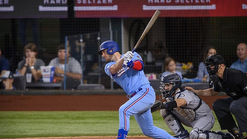 Jun 5, 2022; Arlington, Texas, USA; Texas Rangers designated hitter Mitch Garver (18) in action during the game between the Texas Rangers and the Seattle Mariners at Globe Life Field. Mandatory Credit: Jerome Miron-USA TODAY Sports