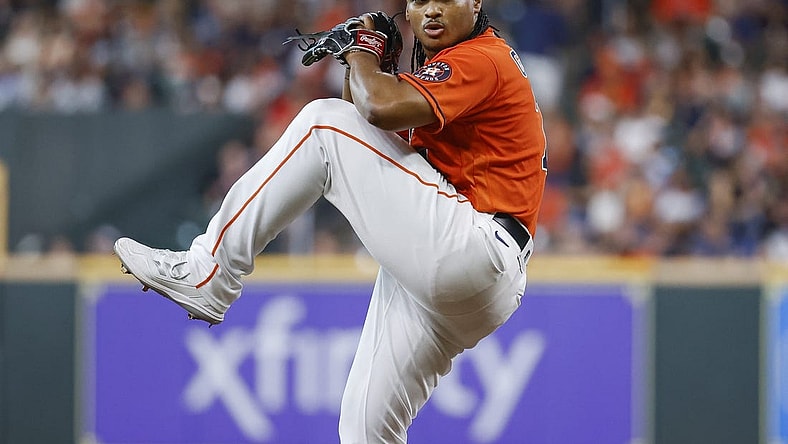 Jun 10, 2022; Houston, Texas, USA; Houston Astros starting pitcher Luis Garcia (77) delivers a pitch during the second inning against the Miami Marlins at Minute Maid Park. Mandatory Credit: Troy Taormina-USA TODAY Sports