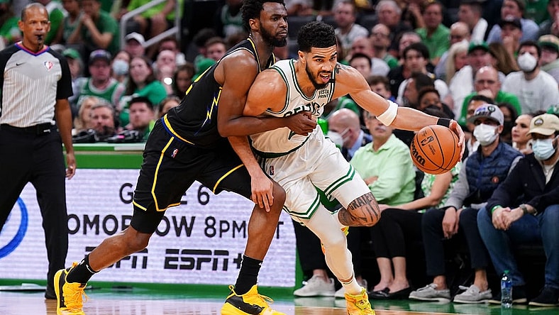 Jun 10, 2022; Boston, Massachusetts, USA; Boston Celtics forward Jayson Tatum (0) dribbles the ball against Golden State Warriors forward Andrew Wiggins (22) during the third quarter of game four in the 2022 NBA Finals at the TD Garden. Mandatory Credit: David Butler II-USA TODAY Sports