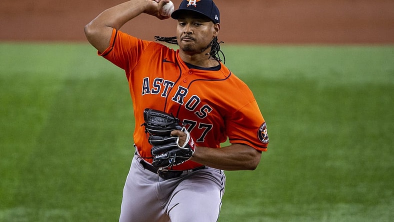 Jun 15, 2022; Arlington, Texas, USA; Houston Astros starting pitcher Luis Garcia (77) pitches against the Texas Rangers during the first inning at Globe Life Field. Mandatory Credit: Jerome Miron-USA TODAY Sports