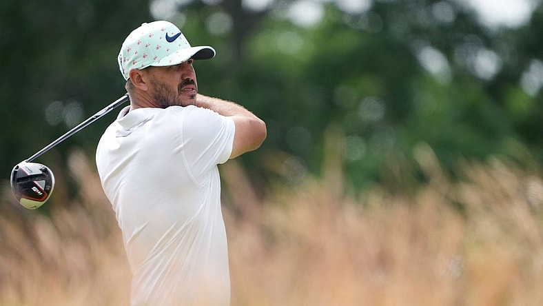 Jun 17, 2022; Brookline, Massachusetts, USA; Brooks Koepka plays his shot from the 10th tee during the second round of the U.S. Open golf tournament. Mandatory Credit: John David Mercer-USA TODAY Sports