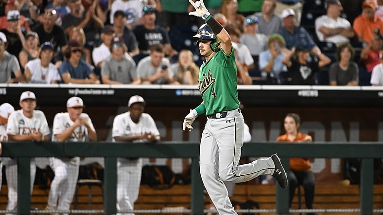 Jun 17, 2022; Omaha, NE, USA; Notre Dame Fighting Irish first baseman Carter Putz (4) rounds the bases after hitting a home run in the ninth inning against the Texas Longhorns at Charles Schwab Field. Mandatory Credit: Steven Branscombe-USA TODAY Sports
