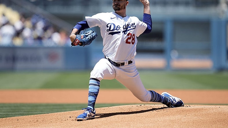 Jun 19, 2022; Los Angeles, California, USA;  Los Angeles Dodgers starting pitcher Andrew Heaney (28) delivers a pitch in the first inning against the Cleveland Guardians at Dodger Stadium. Mandatory Credit: Kirby Lee-USA TODAY Sports