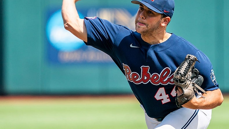 Jun 23, 2022; Omaha, NE, USA; Ole Miss Rebels starting pitcher Dylan DeLucia (44) pitches against the Arkansas Razorbacks during the first inning at Charles Schwab Field. Mandatory Credit: Dylan Widger-USA TODAY Sports