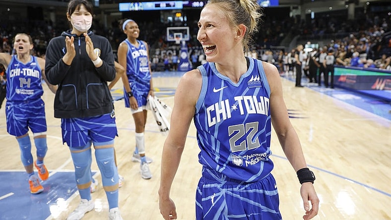 Jun 26, 2022; Chicago, Illinois, USA; Chicago Sky guard Courtney Vandersloot (22) celebrates after scoring the game winning basket against the Minnesota Lynx during the second half of a WNBA game at Wintrust Arena. Mandatory Credit: Kamil Krzaczynski-USA TODAY Sports