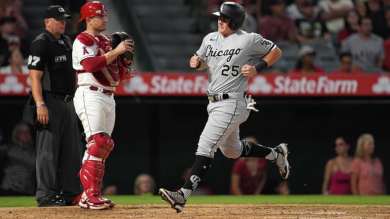 Jun 27, 2022; Anaheim, California, USA; Chicago White Sox designated hitter Andrew Vaughn (25) crosses home plate to score in the sixth inning as Los Angeles Angels catcher Max Stassi (33) watches at Angel Stadium. Mandatory Credit: Kirby Lee-USA TODAY Sports