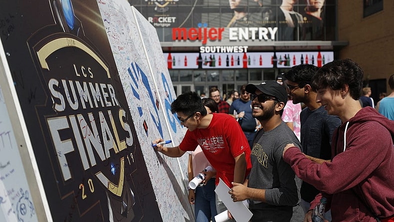 Aug 25, 2019; Detroit, MI, USA; Fans sign the large signing board outside the southwest entrance before the LCS Summer Finals event between Team Liquid and Team Cloud9 at Little Caesars Arena. Mandatory Credit: Raj Mehta-USA TODAY Sports