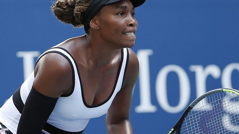Aug 26, 2019; Flushing, NY, USA; Venus Williams of the United States prepares to return serve against Saisai Zheng of China (not pictured) in the first round on day one of the 2019 U.S. Open tennis tournament at USTA Billie Jean King National Tennis Center. Mandatory Credit: Geoff Burke-USA TODAY Sports