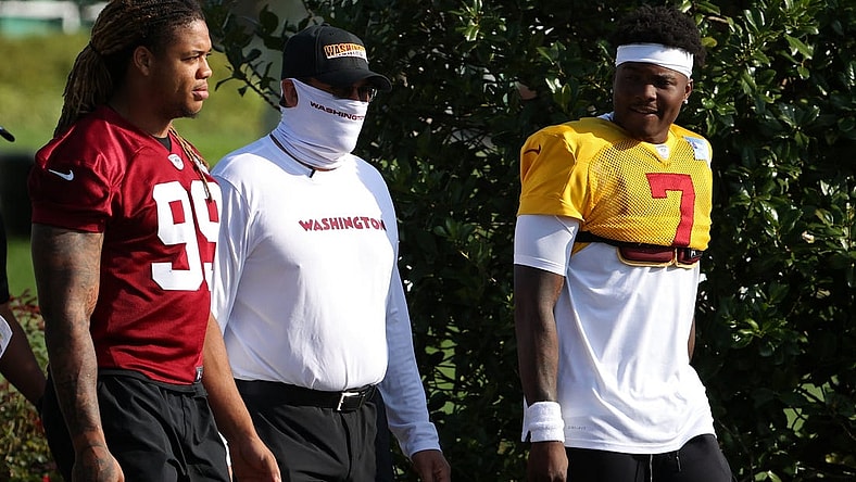Aug 20, 2020; Ashburn, Virginia, USA; Washington Football Team defensive end Chase Young (99), head coach Ron Rivera (M), and quarterback Dwayne Haskins Jr. (7) walk to the field prior to day twenty-three of training camp at Inova Sports Performance Center in Ashburn, Virginia. Mandatory Credit: Geoff Burke-USA TODAY Sports