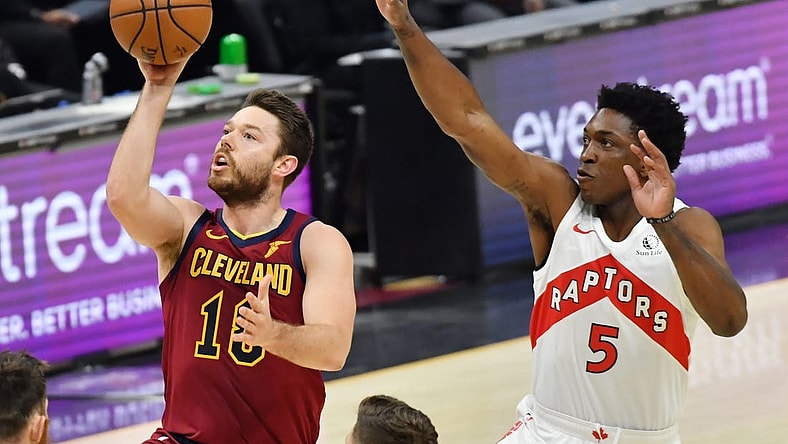 Apr 10, 2021; Cleveland, Ohio, USA; Cleveland Cavaliers guard Matthew Dellavedova (18) shoots the ball against Toronto Raptors forward Stanley Johnson (5) during the first quarter at Rocket Mortgage FieldHouse. Mandatory Credit: Ken Blaze-USA TODAY Sports