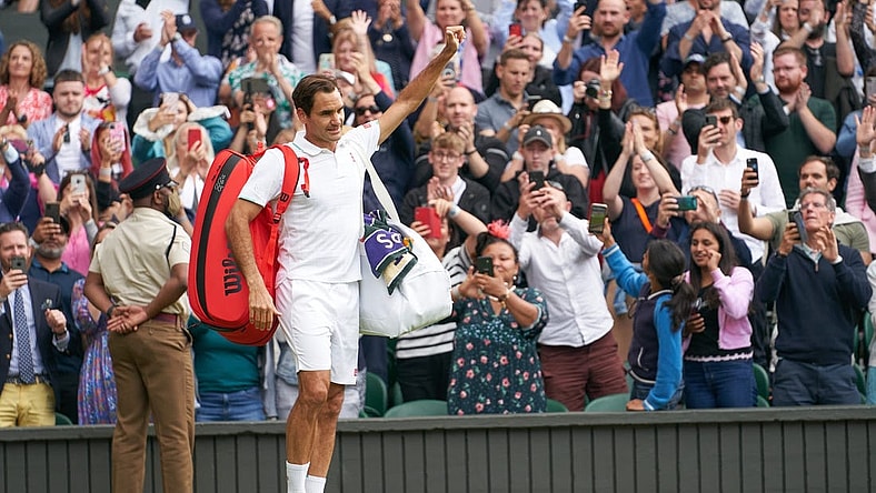 Jul 7, 2021; London, United Kingdom; Roger Federer (SUI) waving farewell to the Centre Court fans after losing to Hubert Hurkacz (POL) in the quarter finals at All England Lawn Tennis and Croquet Club. Mandatory Credit: Peter van den Berg-USA TODAY Sports