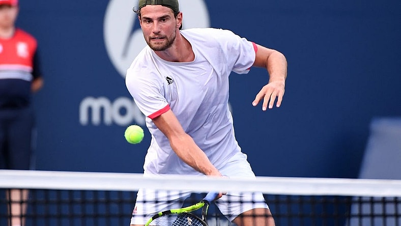 Aug 7, 2021; Toronto, Ontario, Canada; Maxime Cressy of the United States plays a shot against Feliciano Lopez of Spain in first round qualifying play for the National Bank Open at the Aviva Centre. Mandatory Credit: Dan Hamilton-USA TODAY Sports