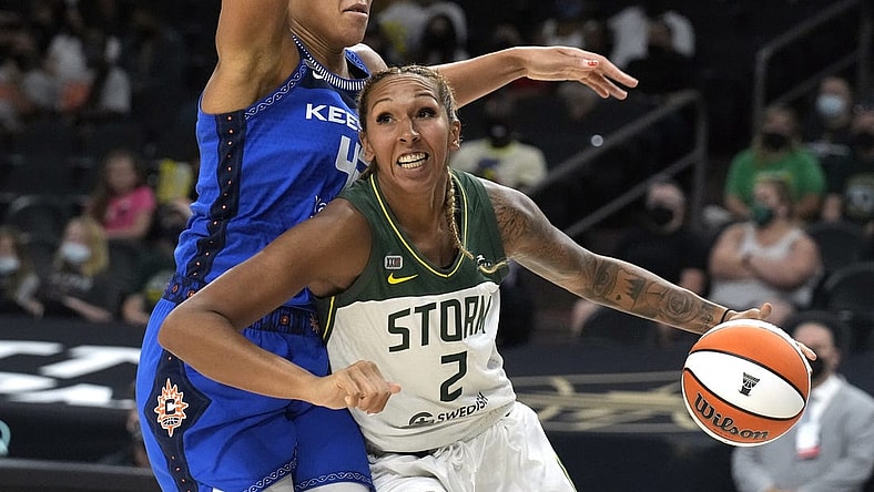 Aug 12, 2021; Phoenix, Arizona, USA; Seattle Storm center Mercedes Russell (2) drives against Connecticut Sun forward Brionna Jones (42) in the first half during the Inaugural WNBA Commissioners Cup Championship Game at Footprint Center. Mandatory Credit: Rick Scuteri-USA TODAY Sports