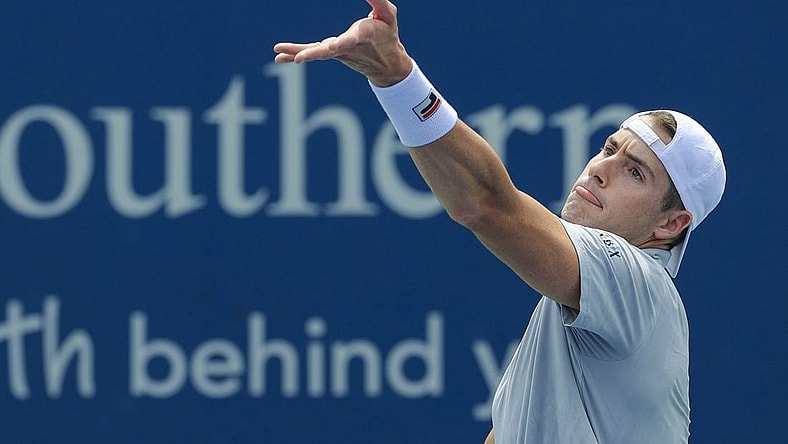 Aug 17, 2021; Mason, OH, USA; John Isner (USA) serves the ball against Cameron Norrie (GBR) during the Western and Southern Open tennis tournament at Lindner Family Tennis Center. Mandatory Credit: Aaron Doster-USA TODAY Sports