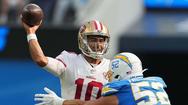Aug 22, 2021; Inglewood, California, USA; San Francisco 49ers quarterback Jimmy Garoppolo (10) throws the ball under pressure from Los Angeles Chargers linebacker Kyler Fackrell (52) in the first quarter at SoFi Stadium. Mandatory Credit: Kirby Lee-USA TODAY Sports