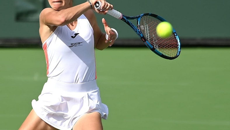 Oct 6, 2021; Indian Wells, CA, USA; Magda Linette (POL) hits a shot during her first round match against  Rebecca Peterson (not pictured) in the BNP Paribas Open at the Indian Wells Tennis Garden. Mandatory Credit: Jayne Kamin-Oncea-USA TODAY Sports