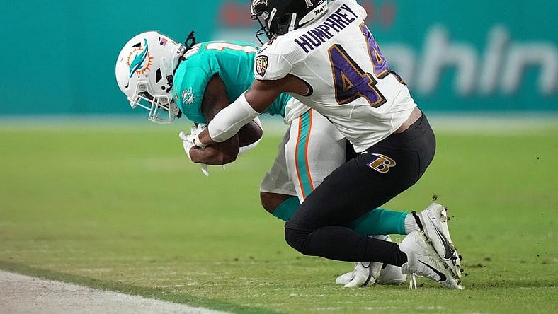 Nov 11, 2021; Miami Gardens, Florida, USA; Baltimore Ravens cornerback Marlon Humphrey (44) tackles Miami Dolphins wide receiver Jaylen Waddle (17) during the first half at Hard Rock Stadium. Mandatory Credit: Jasen Vinlove-USA TODAY Sports