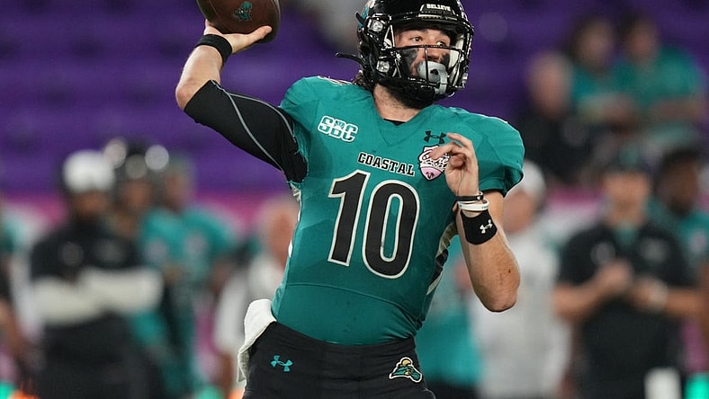 Dec 17, 2021; Orlando, Florida, USA; Coastal Carolina Chanticleers quarterback Grayson McCall (10) attempts a pass against the Northern Illinois Huskies during the second half of the 2021 Cure Bowl game at Exploria Stadium. Mandatory Credit: Jasen Vinlove-USA TODAY Sports